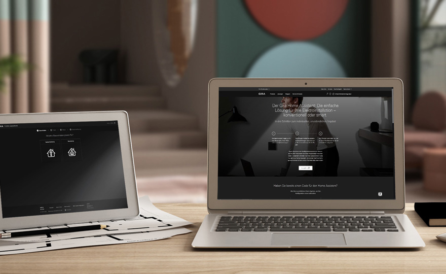 Architect designer desktop concept, laptop and tablet on wooden Gira Home Assistent_Kynast Elektroanlagen